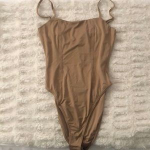 Never worn body suit! Beige color size 4